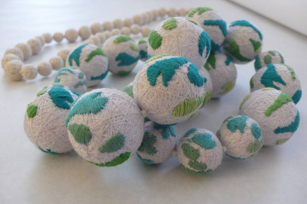 Hand-embroidered textile spheres, XUAN atelier