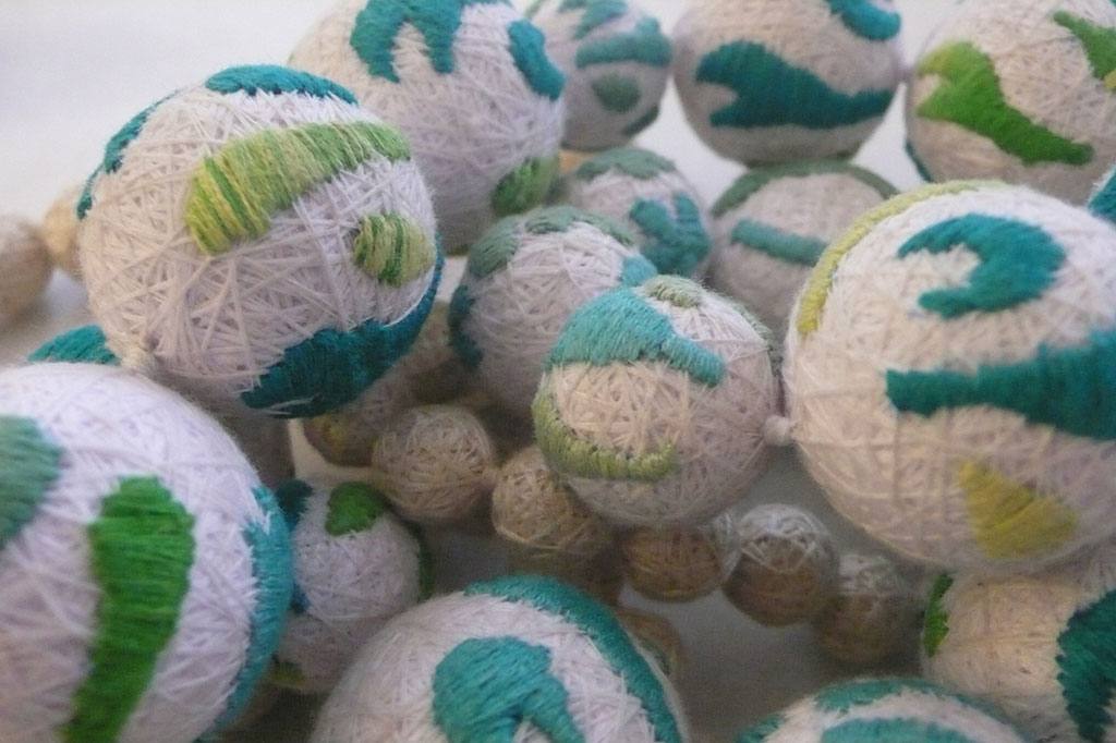 Hand-embroidered textile spheres, XUAN atelier