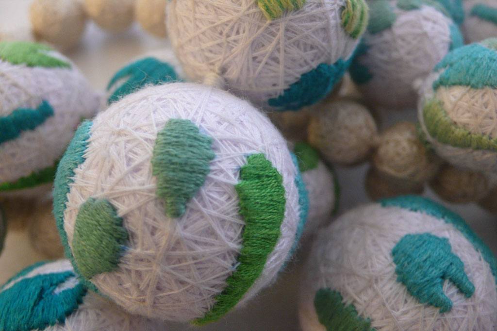 Hand-embroidered textile spheres, XUAN atelier