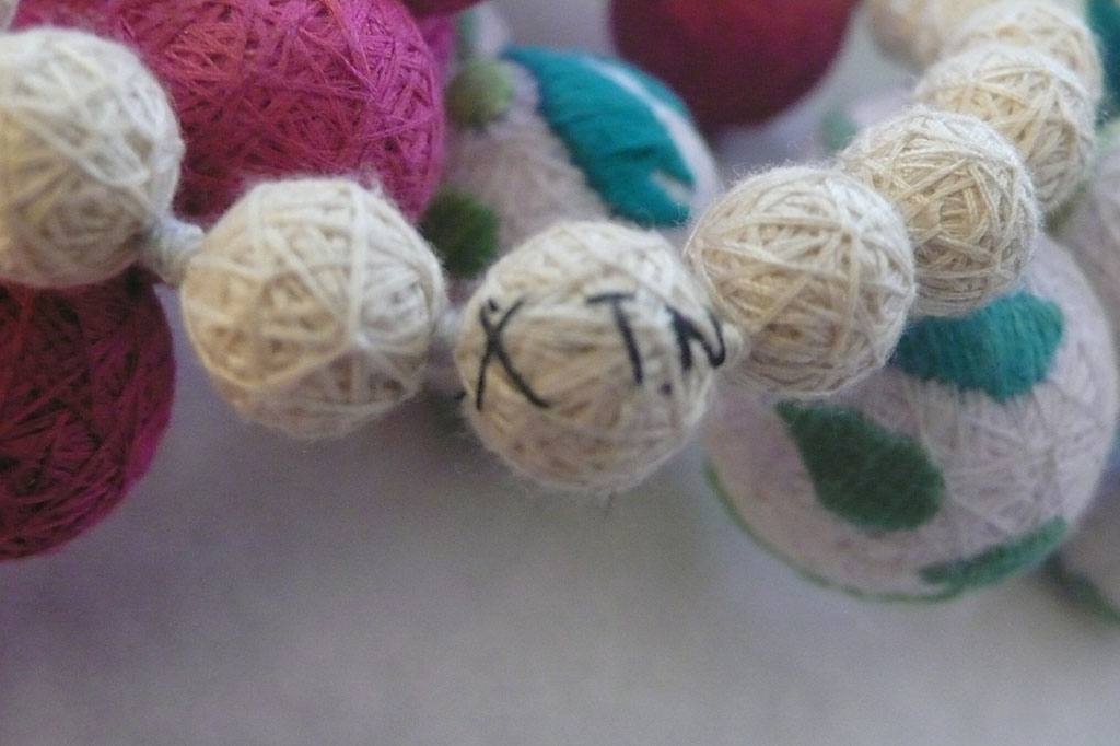 Hand-embroidered textile spheres, XUAN atelier